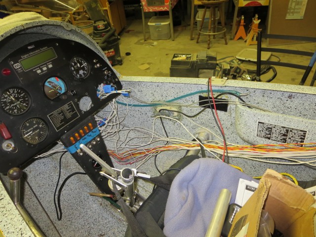 Another picture of the cockpit. Here the wiring is hanging loose, the radio and transponder are out, and you can see where the stick was cutoff for the video game controller grip, just above the brake handle bracket.