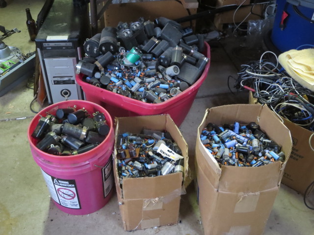 A couple years worth of replaced caps, from all the recapping we do, easily 200 lb of old caps.